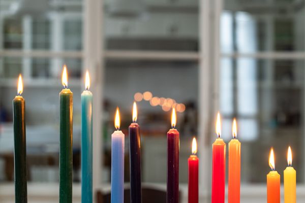 Multi coloured candles in a row